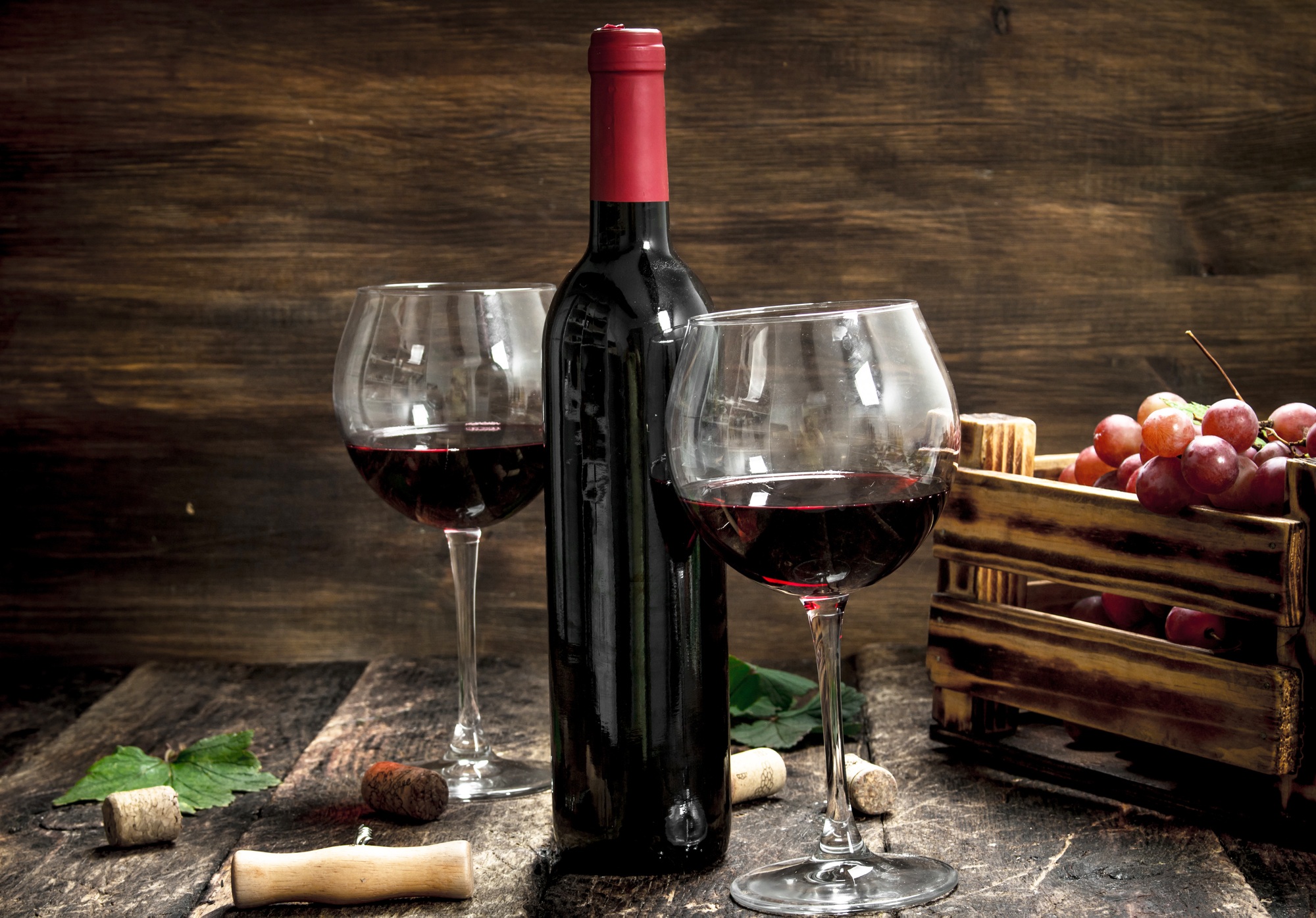 Wine background. Red wine with a box of grapes.